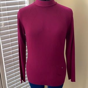 Burberry turtleneck sweater.